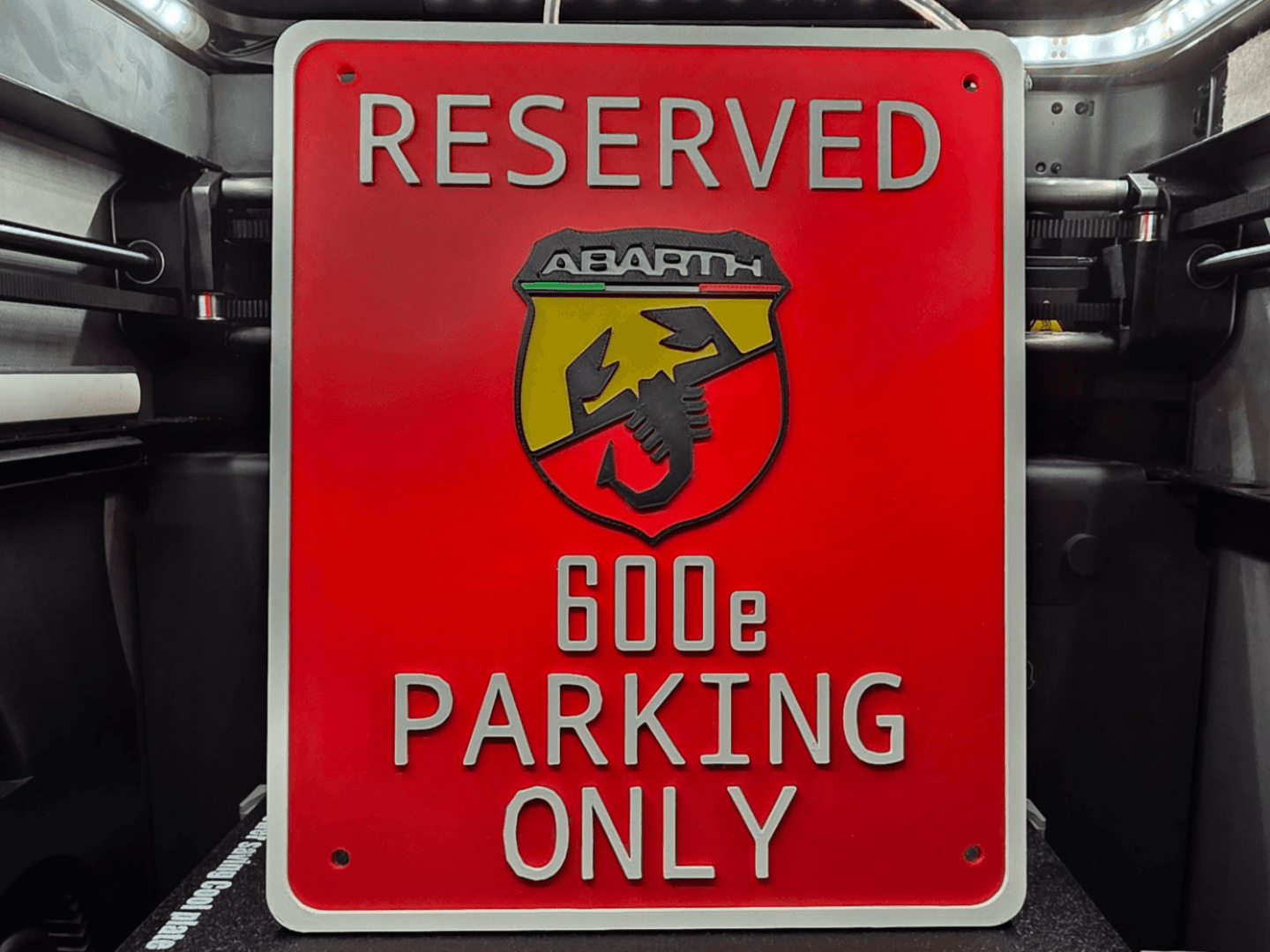 Reserved Abarth 600e parking sign