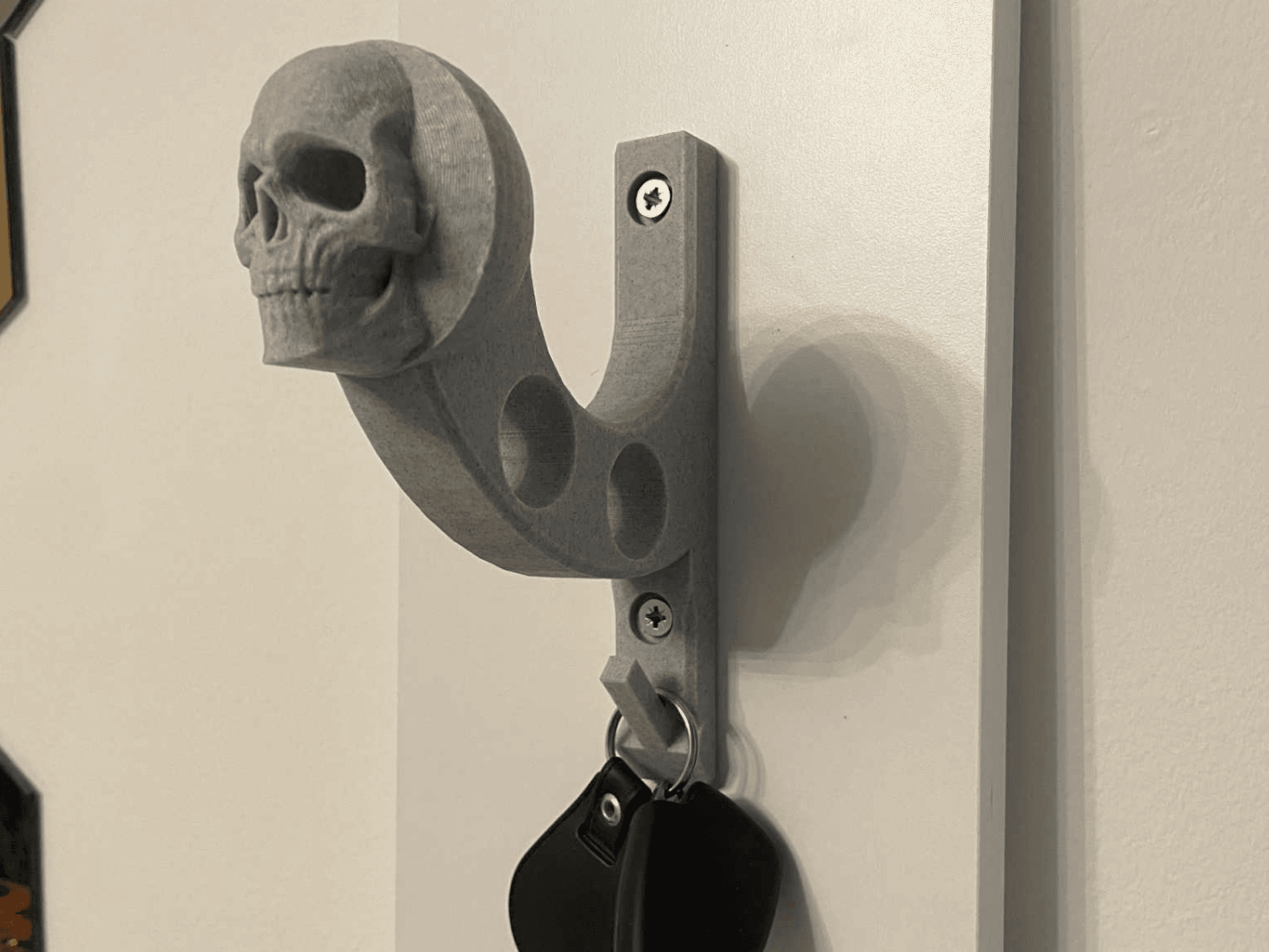 Helmet holder, keys and jacket