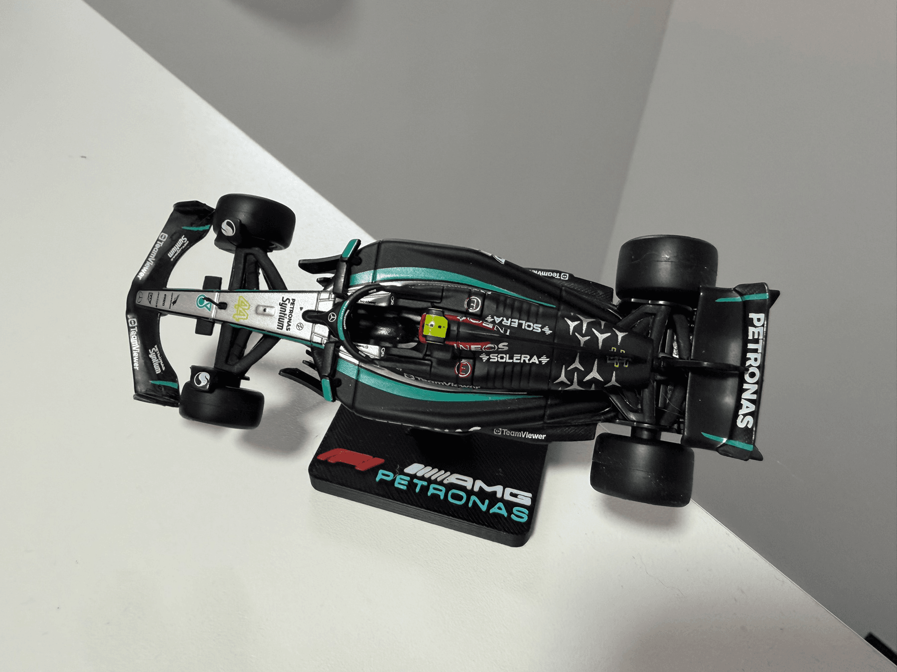 Mercedes AMG Petronas F1 team 1:43 scale stand