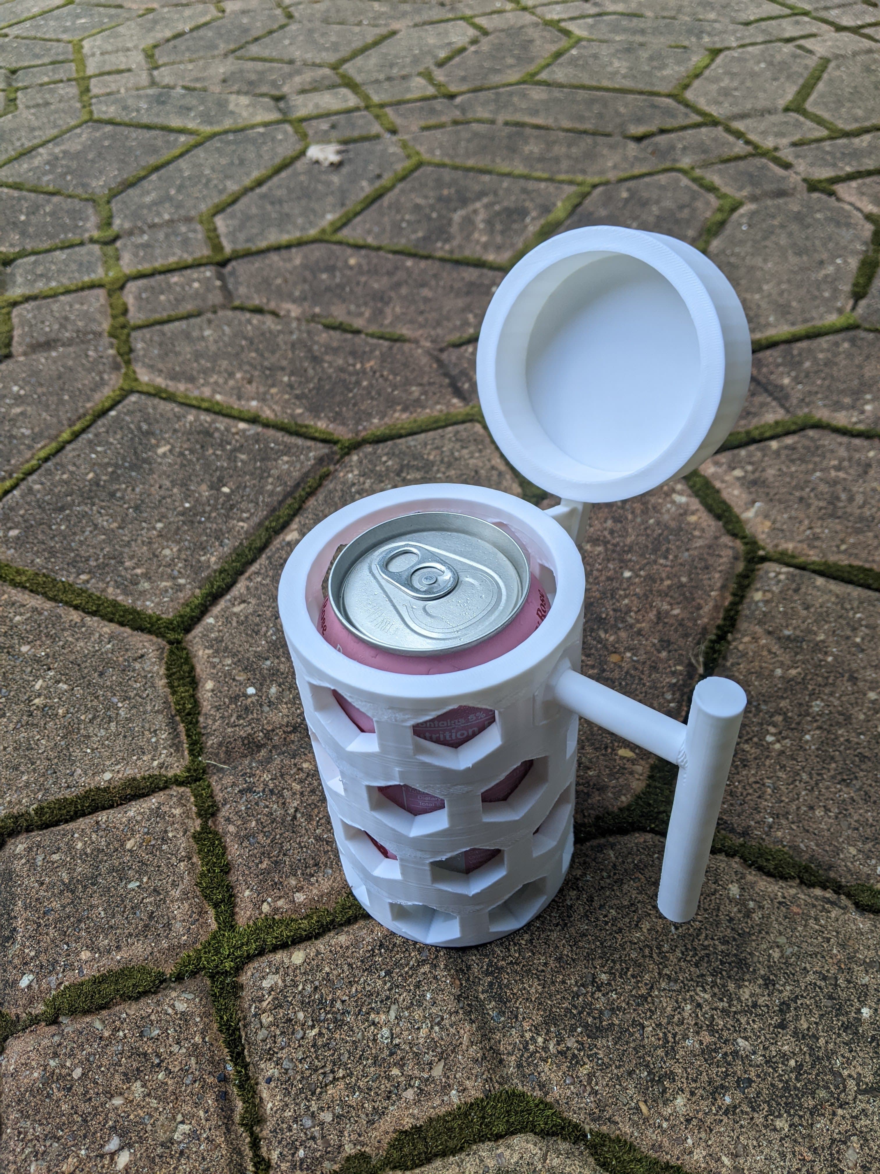 Soda can holder with removable handle, removable cap, and drainage canals